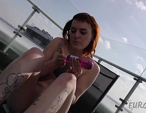 041521_hot_ginger_tattoo_model_brille_masturbating_on_the_roof_terrace_with_a_realistic_dildo
