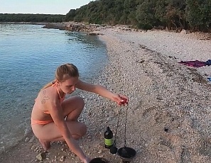 070122_hot_ginger_professional_fire_dancer_lea_playing_with_her_flames_on_the_beach_during_sunset
